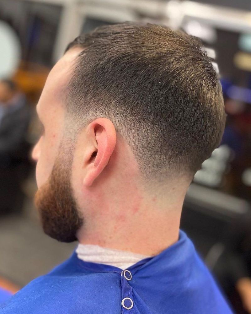 Back view of taper fade with trimmed beard