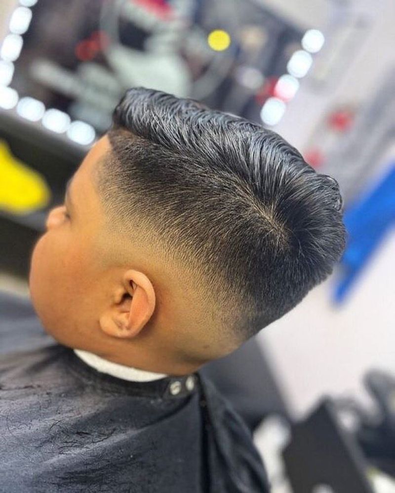 Kid's slicked comb-over with clean skin fade