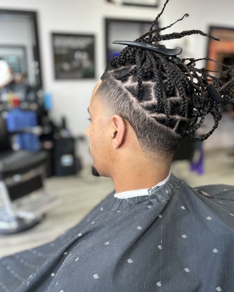 Back view of skin fade with braided top