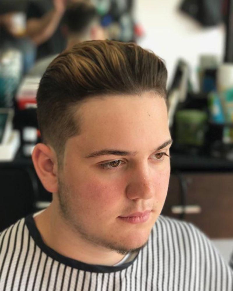 Classic pompadour with subtle taper fade
